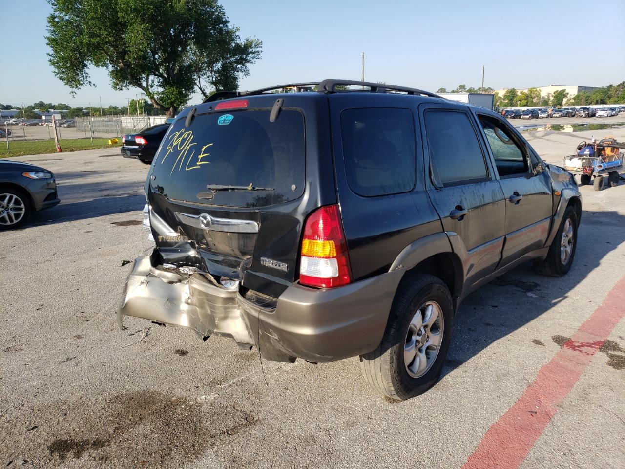 Photo 4 from auction – 2003 MAZDA TRIBUTE LX with VIN 4F2YZ04103KM46928