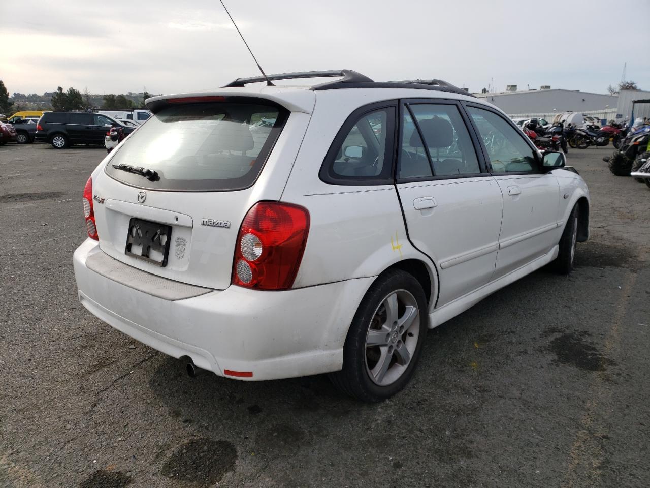 Photo 4 from auction – 2002 MAZDA PROTEGE PR with VIN JM1BJ245021618214