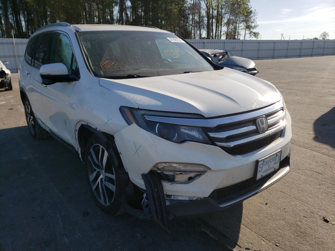 HONDA PILOT TOUR 2016 with VIN 5FNYF5H98GB022812 - Photo from auction