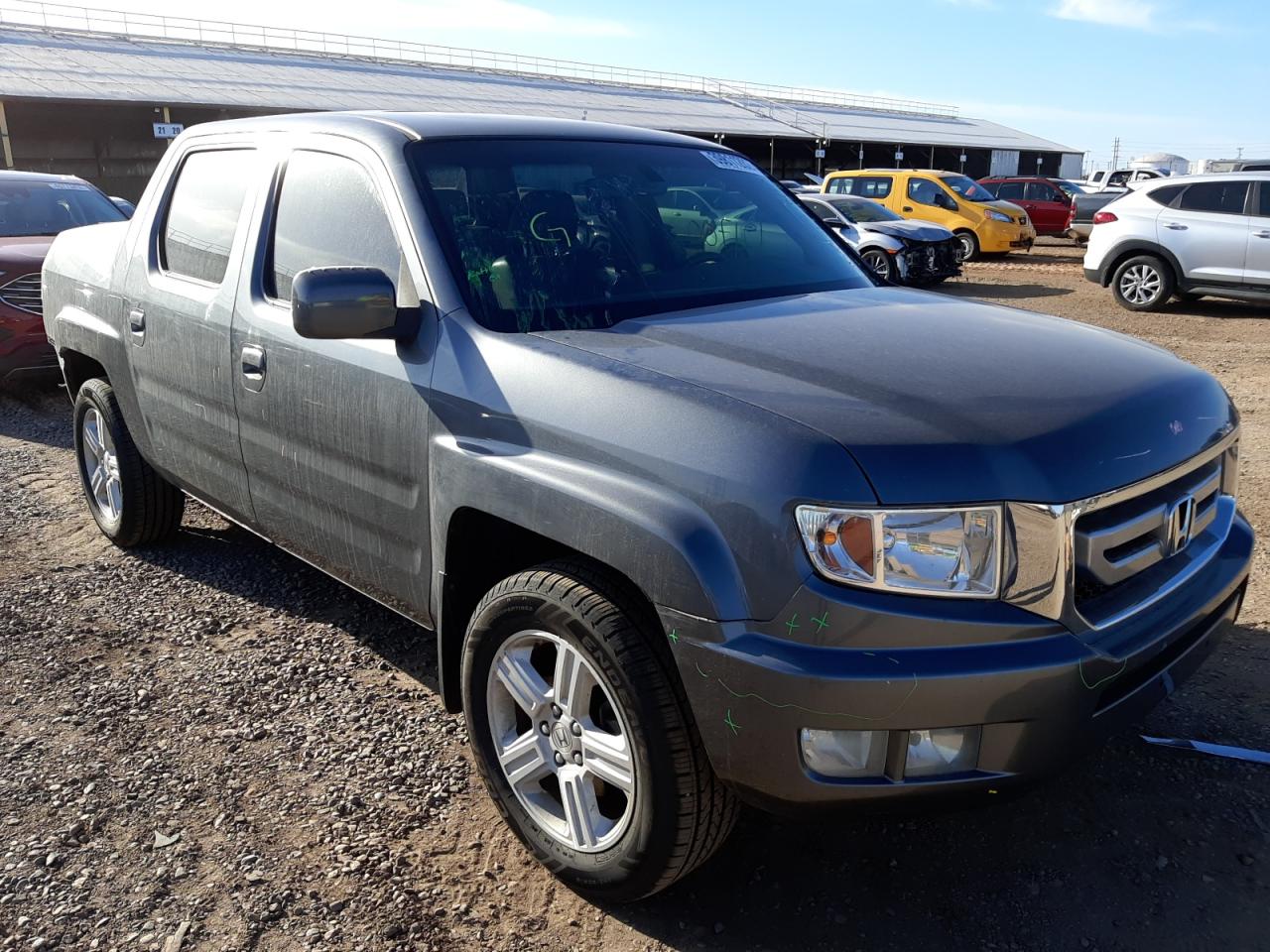 HONDA RIDGELINE 2011 with VIN 5FPYK1F5XBB010231 - Photo from auction