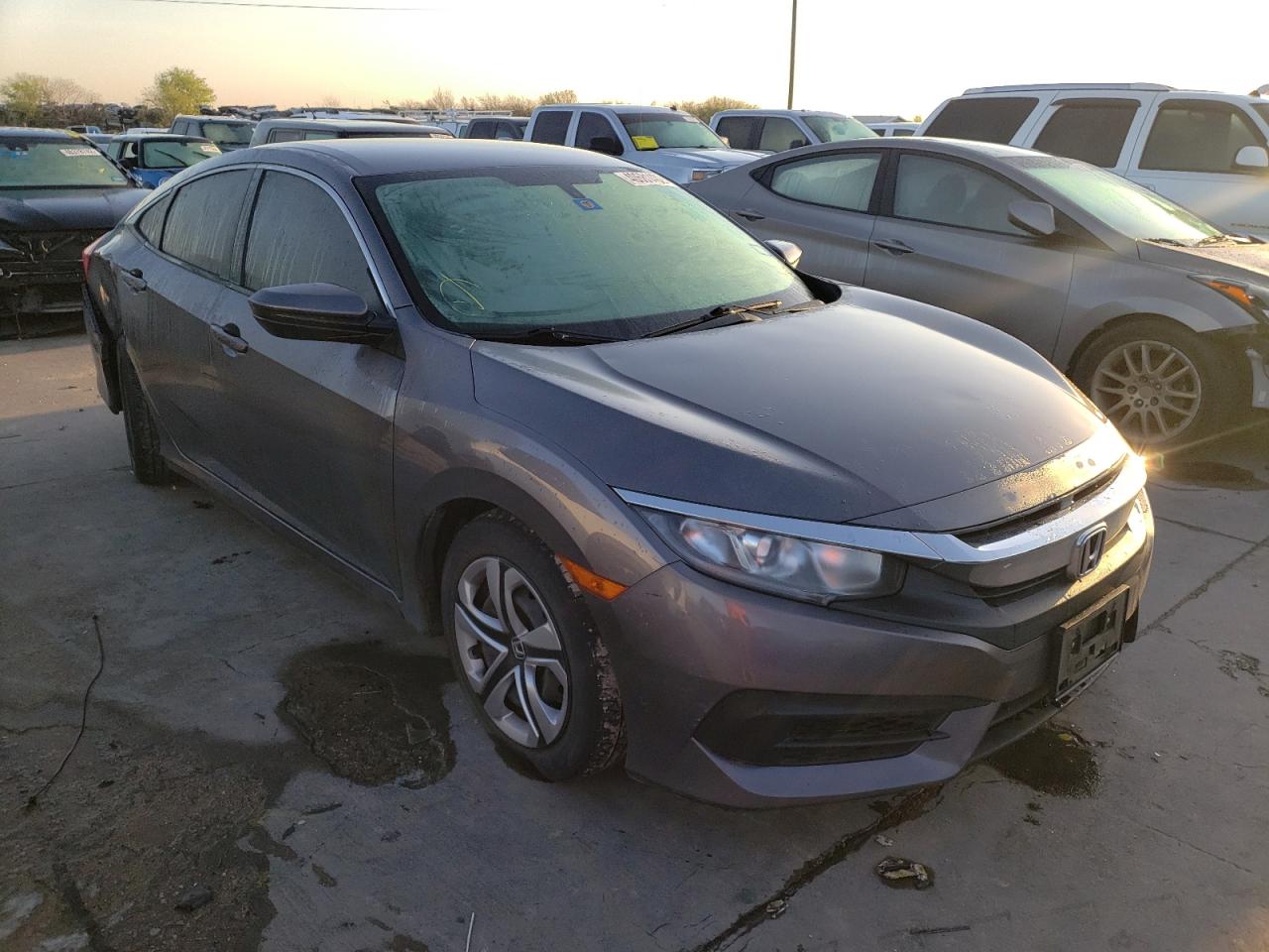 HONDA CIVIC LX 2018 with VIN 19XFC2F55JE002044 - Photo from auction