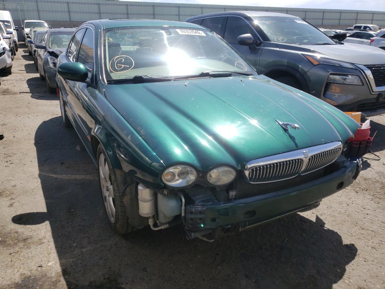 JAGUAR X-TYPE 3.0 2004 with VIN SAJEA51C14WD74911 - Photo from auction