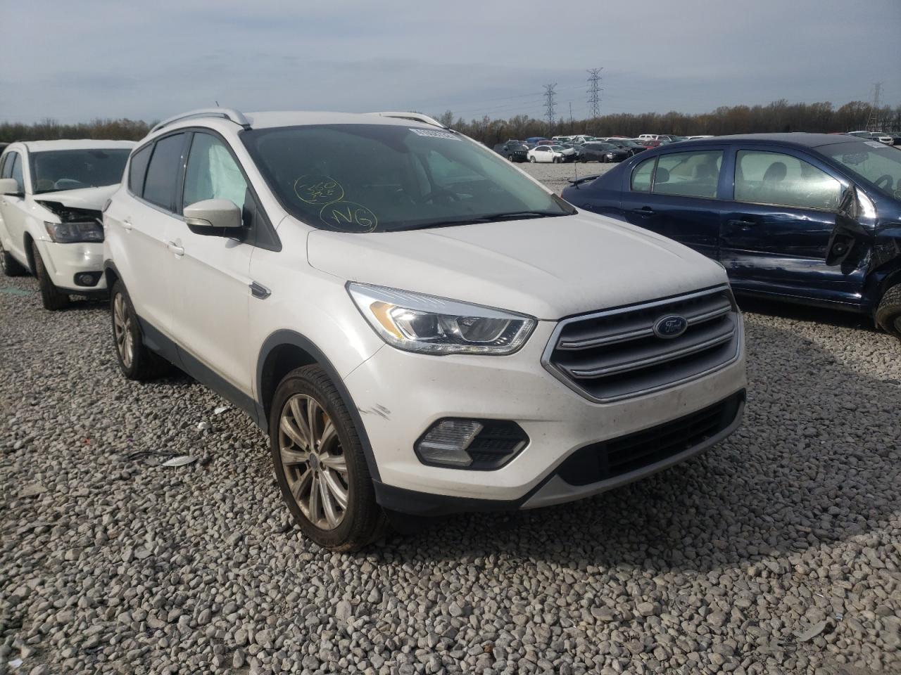 FORD ESCAPE TIT 2017 with VIN 1FMCU0J96HUB49060 - Photo from auction