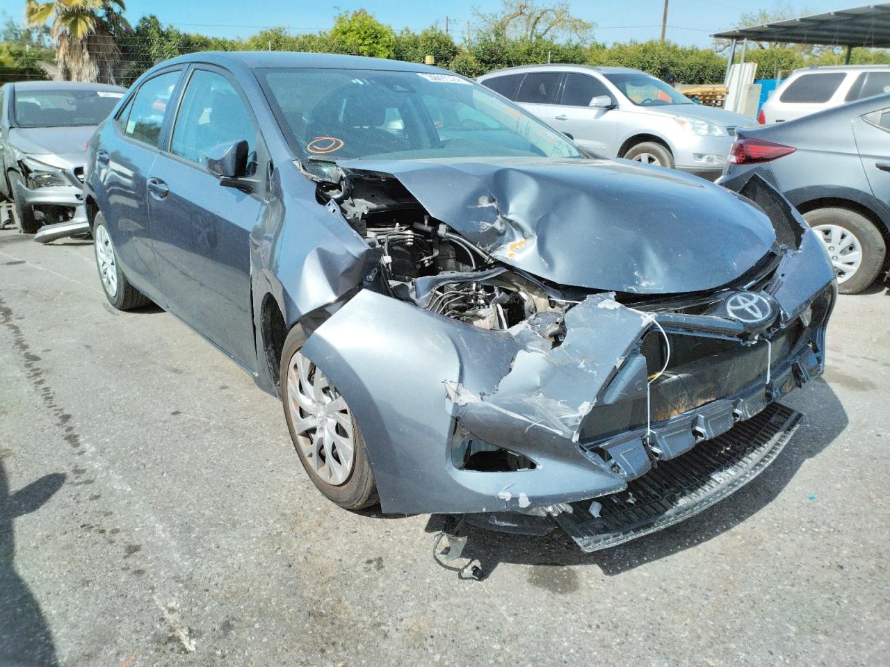 TOYOTA COROLLA L 2018 with VIN 5YFBURHEXJP830557 - Photo from auction