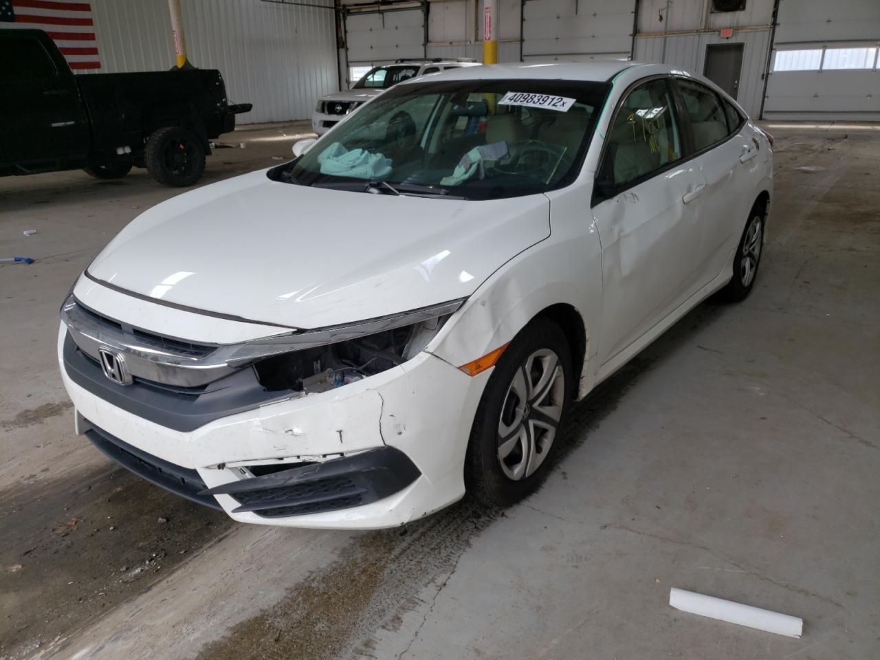Photo 9 from auction – 2018 HONDA CIVIC LX with VIN 19XFC2F57JE039287