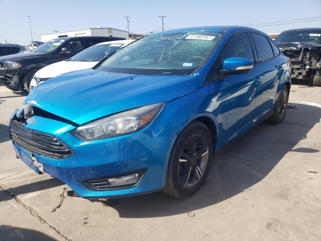 Photo 2 from auction – 2016 FORD FOCUS SE with VIN 1FADP3FE7GL257835