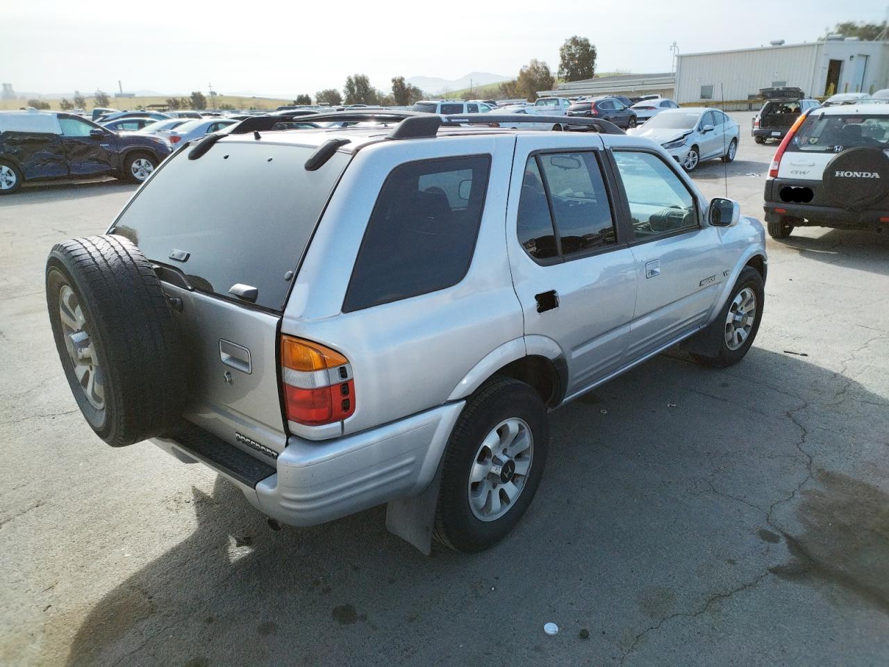 Photo 4 from auction – 1999 HONDA PASSPORT E with VIN 4S6CM58W0X4416210