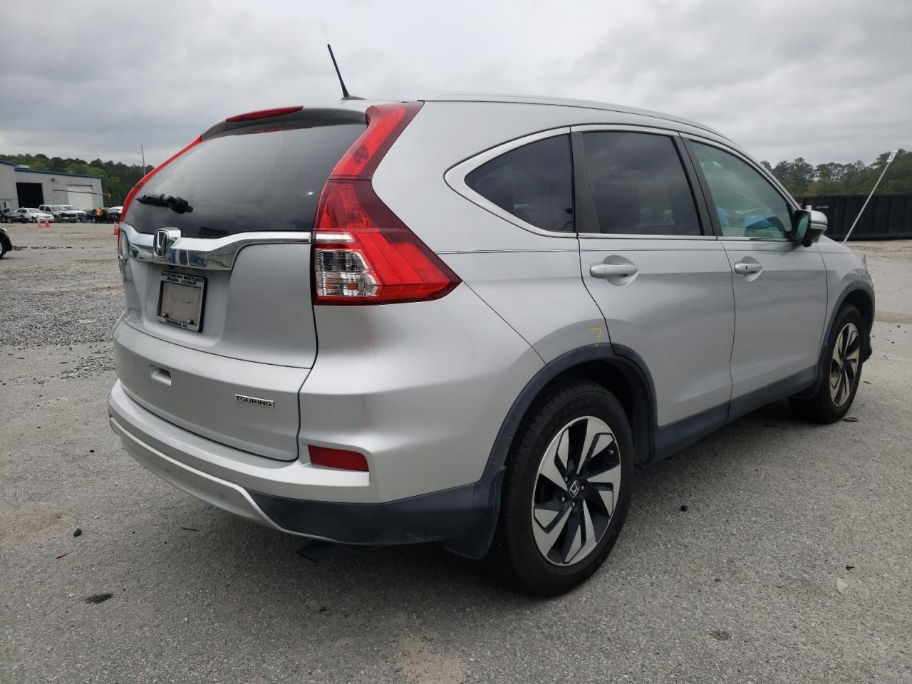 Photo 4 from auction – 2015 HONDA CR-V TOURI with VIN 5J6RM3H95FL020648