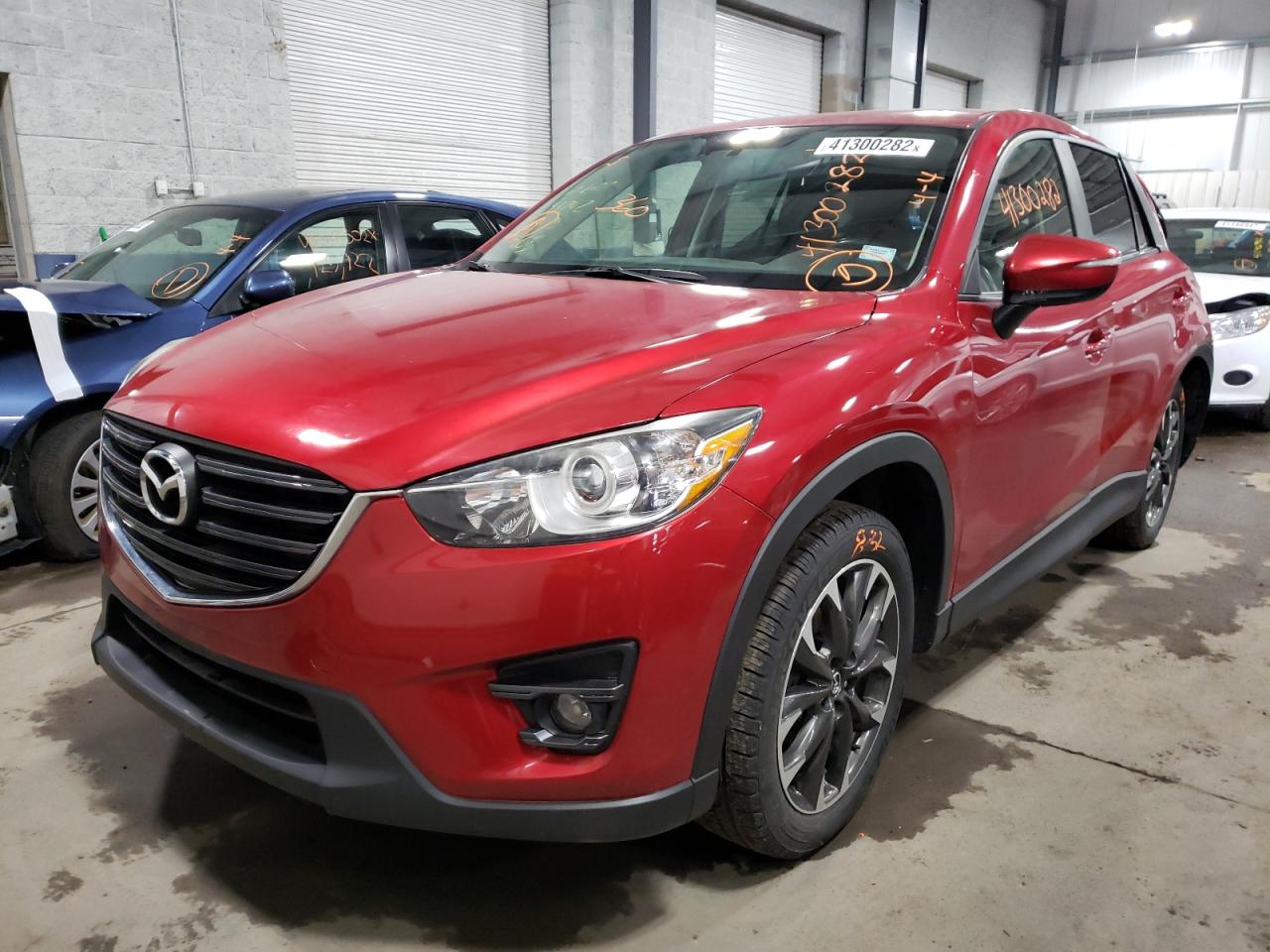 Photo 2 from auction – 2016 MAZDA CX-5 GT with VIN JM3KE4DYXG0659495
