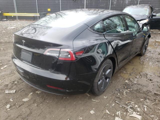 Photo 4 from auction – 2021 TESLA MODEL 3 with VIN 5YJ3E1EA0MF086357