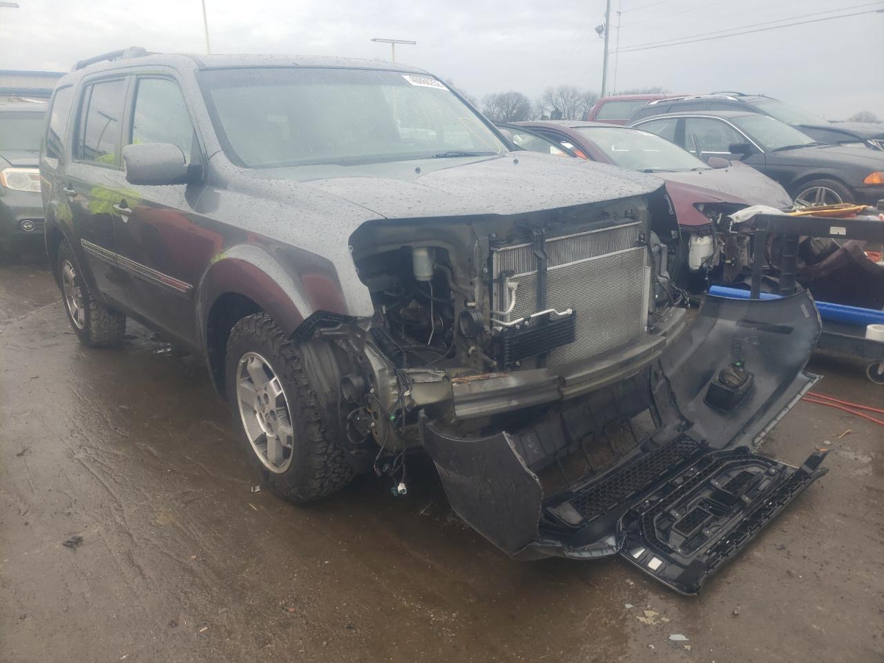 HONDA PILOT TOUR 2011 with VIN 5FNYF4H95BB059240 - Photo from auction