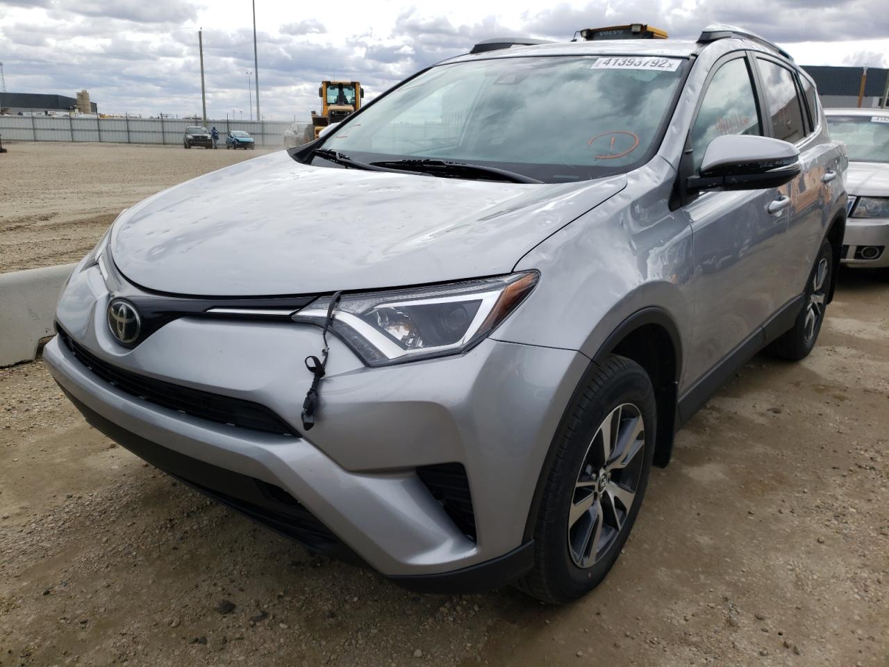 Photo 2 from auction – 2018 TOYOTA RAV4 LE with VIN 2T3BFREV9JW765981