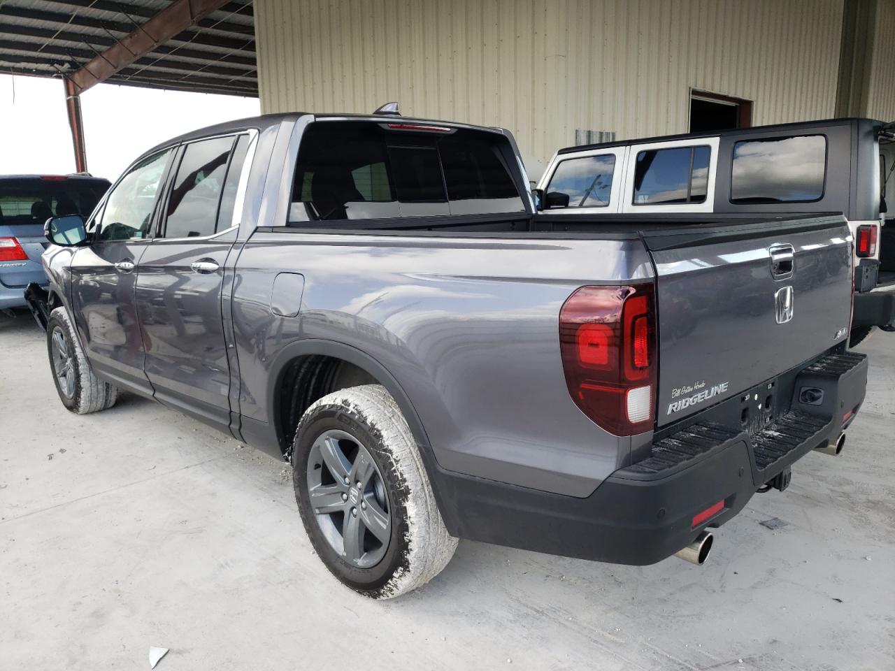 Photo 3 from auction – 2022 HONDA RIDGELINE with VIN 5FPYK3F78NB005627