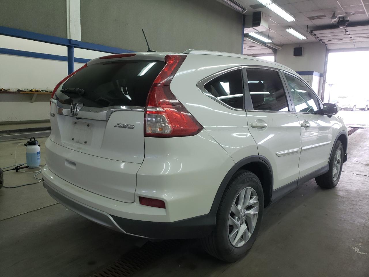 Photo 4 from auction – 2015 HONDA CR-V EXL with VIN 5J6RM4H78FL043880