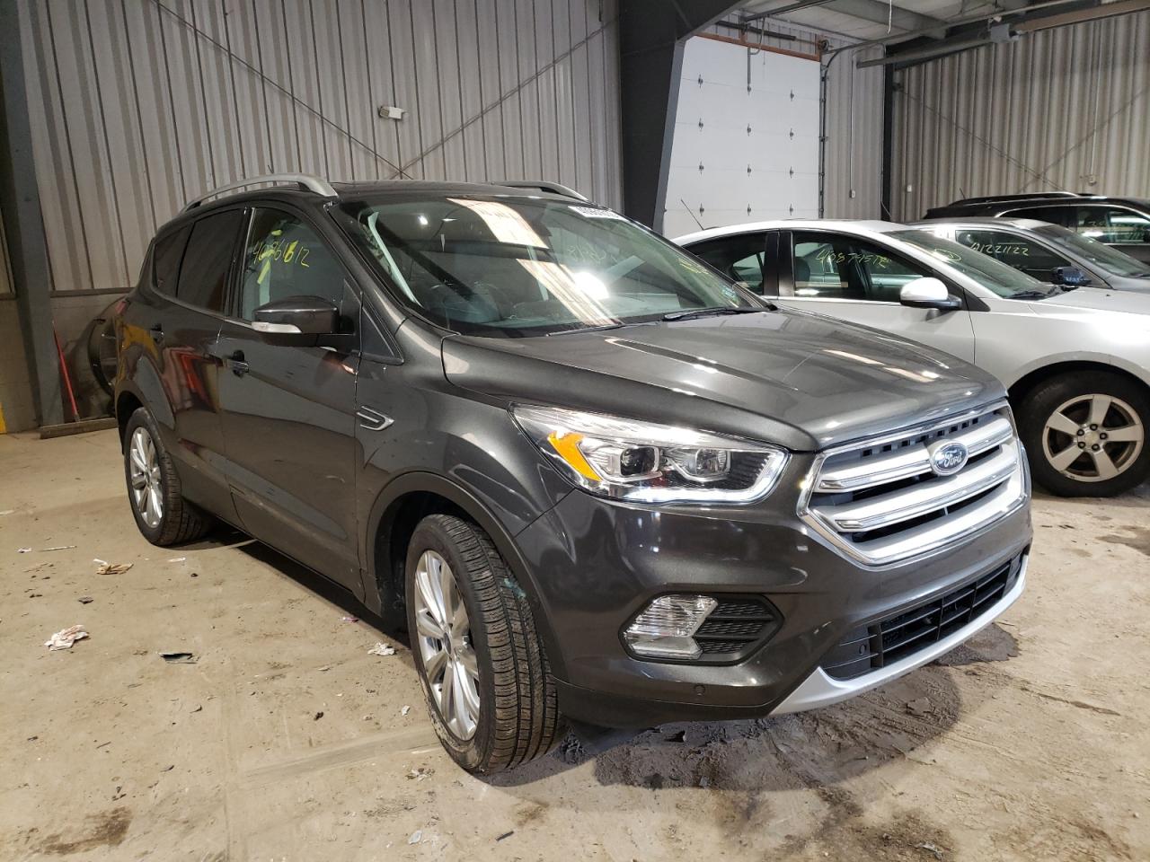 FORD ESCAPE TIT 2018 with VIN 1FMCU9J98JUB80689 - Photo from auction
