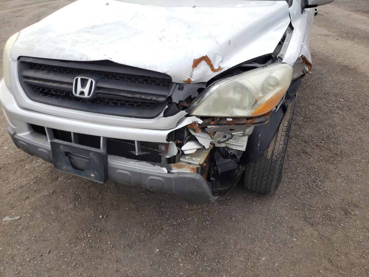 Photo 9 from auction – 2004 HONDA PILOT EX with VIN 2HKYF18454H574990