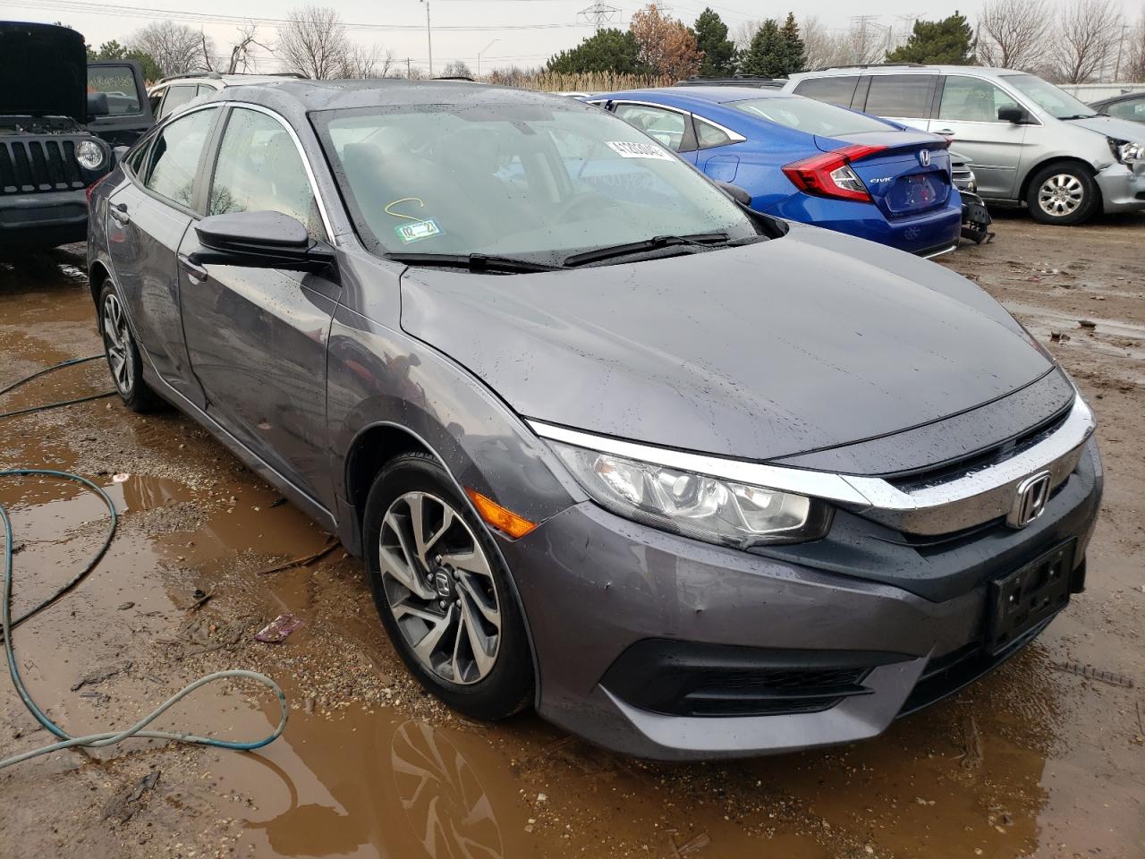 Photo 1 from auction – 2018 HONDA CIVIC EX with VIN 2HGFC2F74JH593071