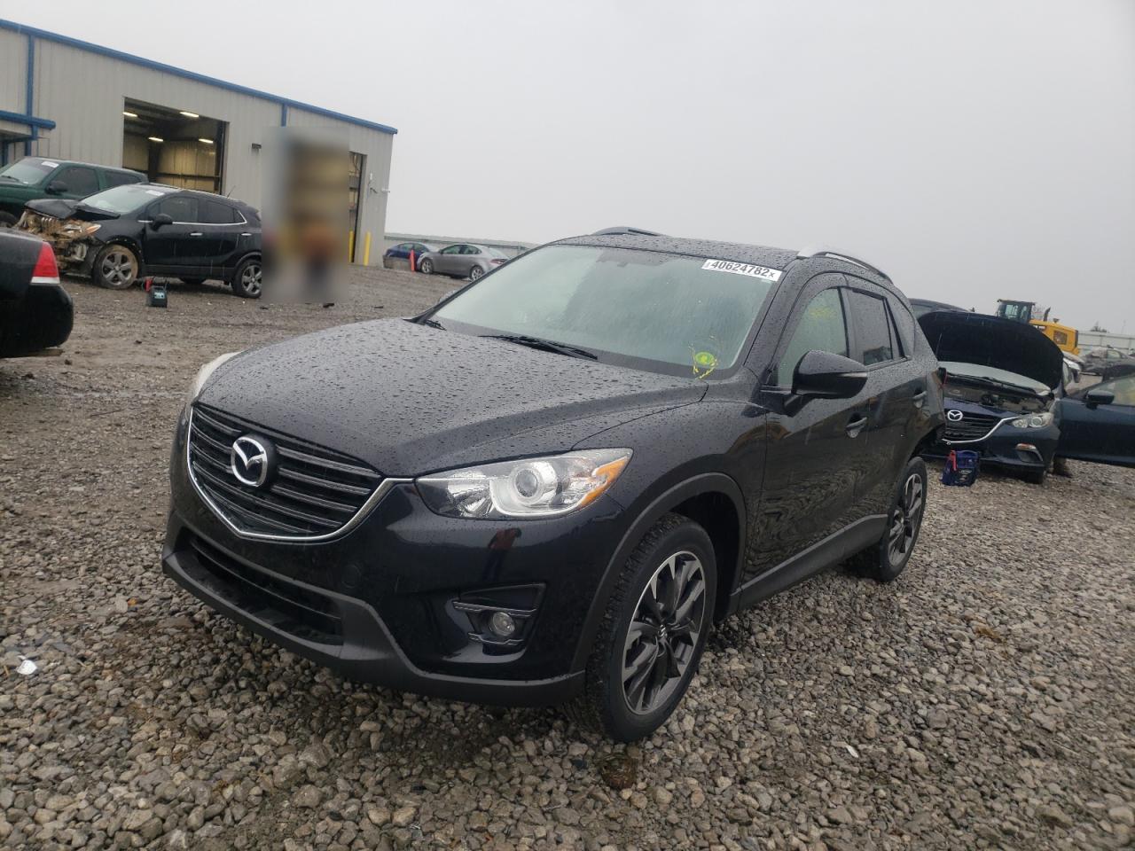 Photo 2 from auction – 2016 MAZDA CX-5 GT with VIN JM3KE4DYXG0782181