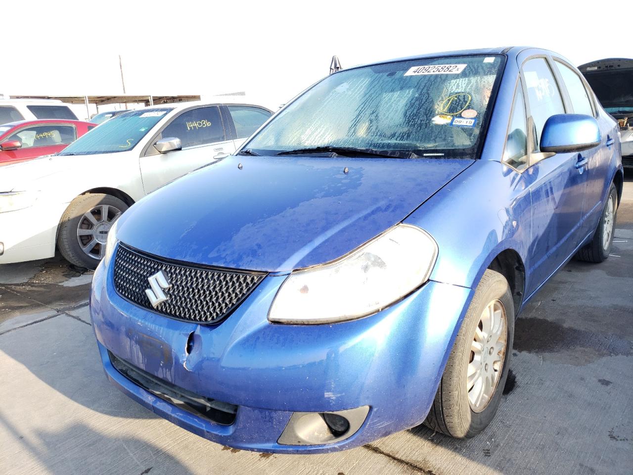 Photo 2 from auction – 2012 SUZUKI SX4 LE with VIN JS2YC5A3XC6302872