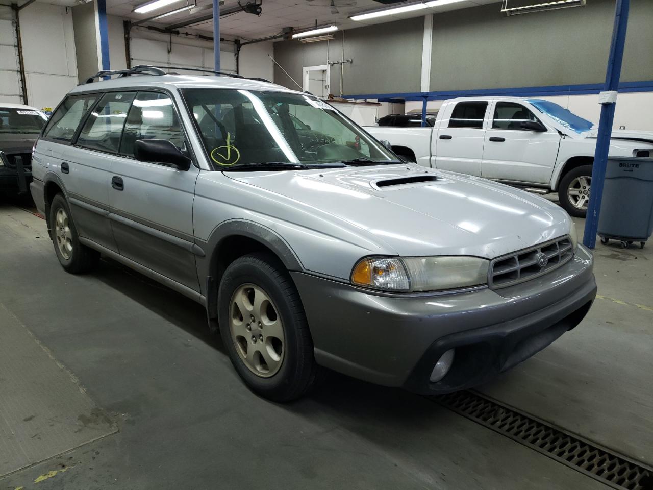 SUBARU LEGACY OUT 1999 with VIN 4S3BG6852X7623144 - Photo from auction