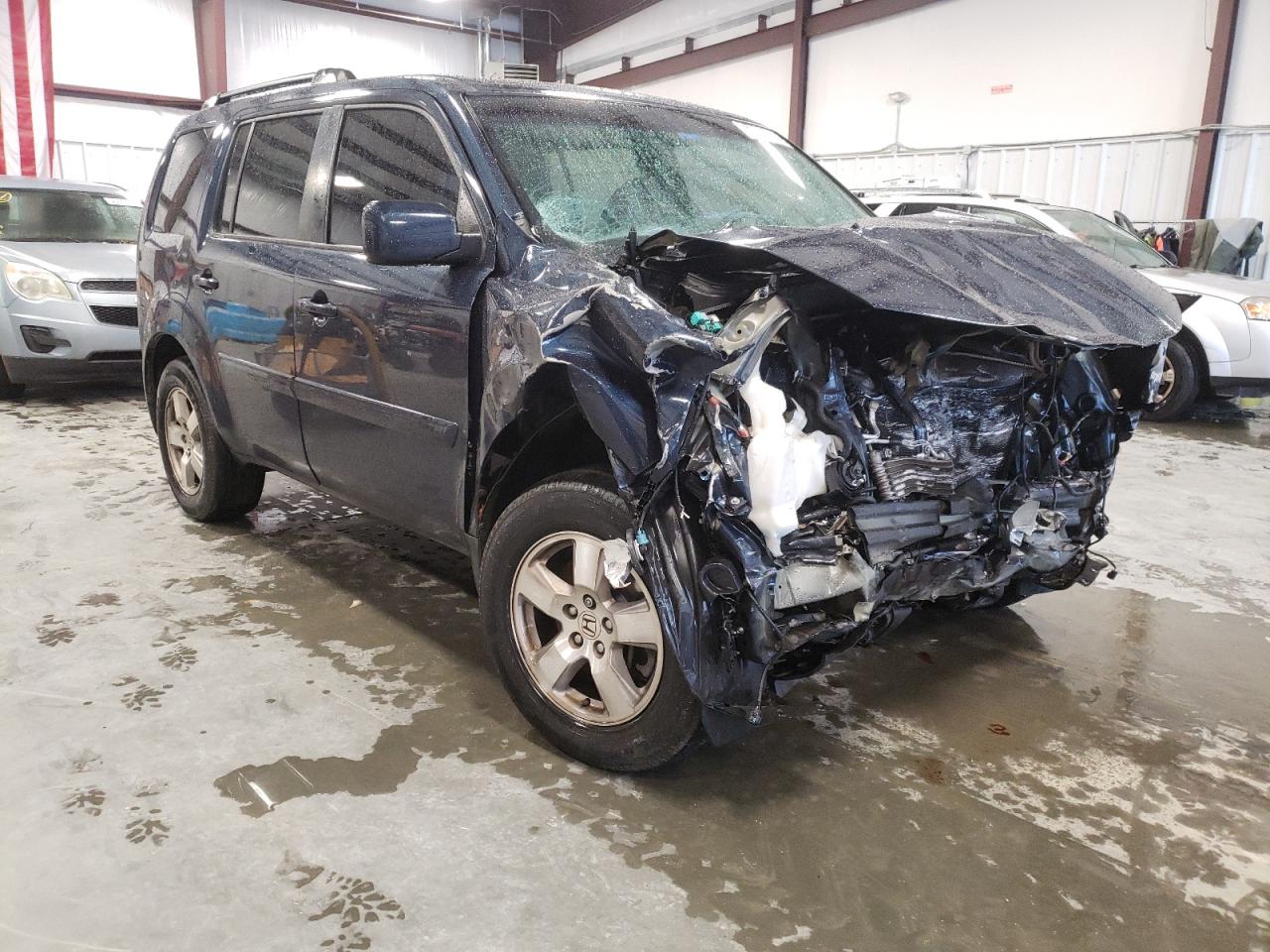 HONDA PILOT EXL 2011 with VIN 5FNYF3H58BB024442 - Photo from auction