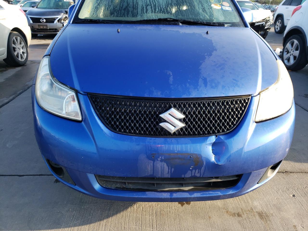 Photo 9 from auction – 2012 SUZUKI SX4 LE with VIN JS2YC5A3XC6302872