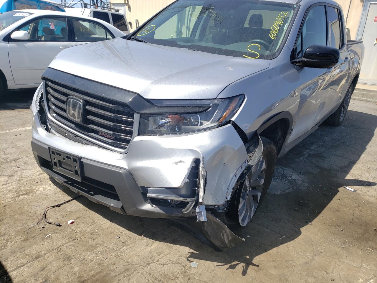 Photo 9 from auction – 2022 HONDA RIDGELINE with VIN 5FPYK3F10NB007058