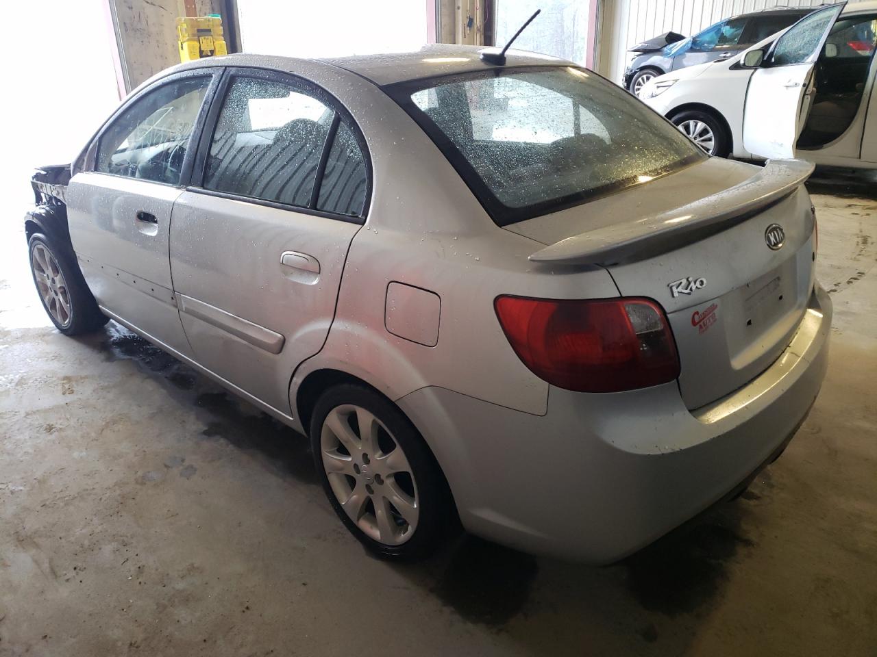 Photo 3 from auction – 2011 KIA RIO BASE with VIN KNADH4A38B6949383