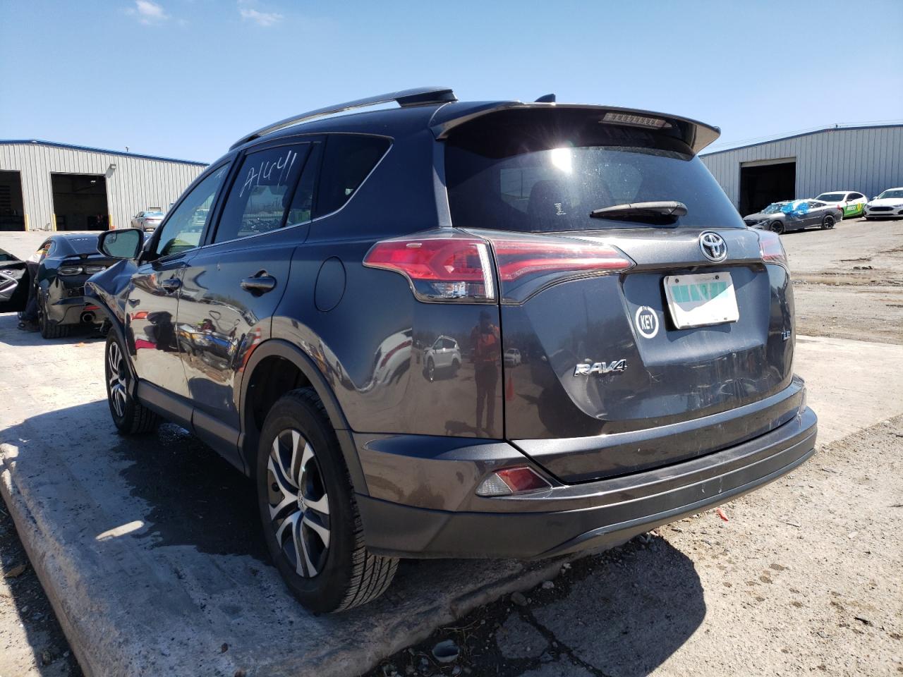 Photo 3 from auction – 2017 TOYOTA RAV4 LE with VIN JTMZFREV2HJ712580