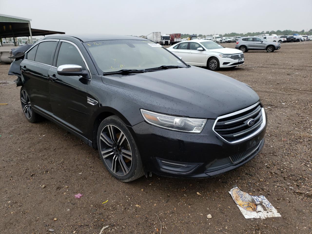 FORD TAURUS LIM 2014 with VIN 1FAHP2F81EG179886 - Photo from auction
