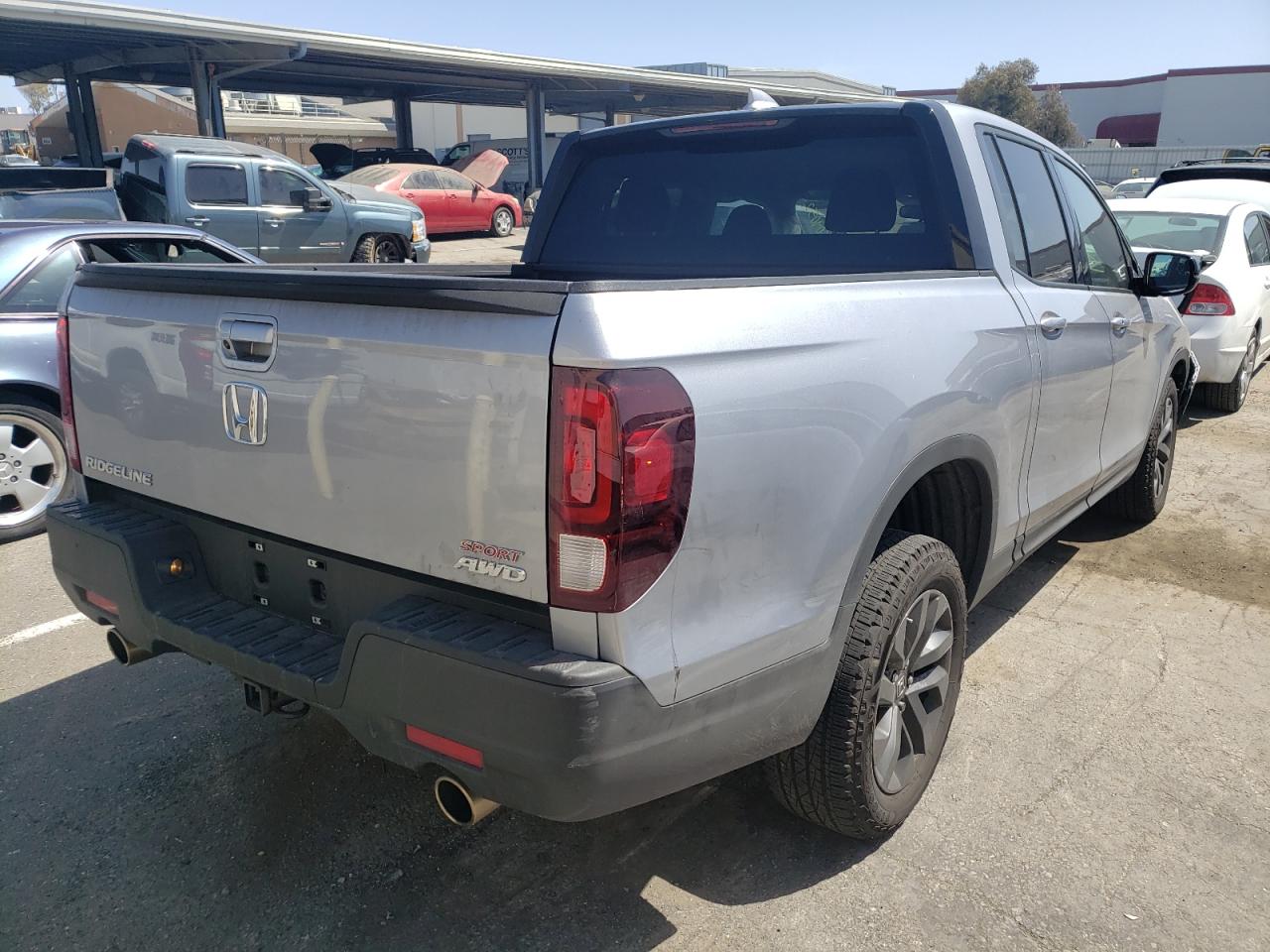 Photo 4 from auction – 2022 HONDA RIDGELINE with VIN 5FPYK3F10NB007058