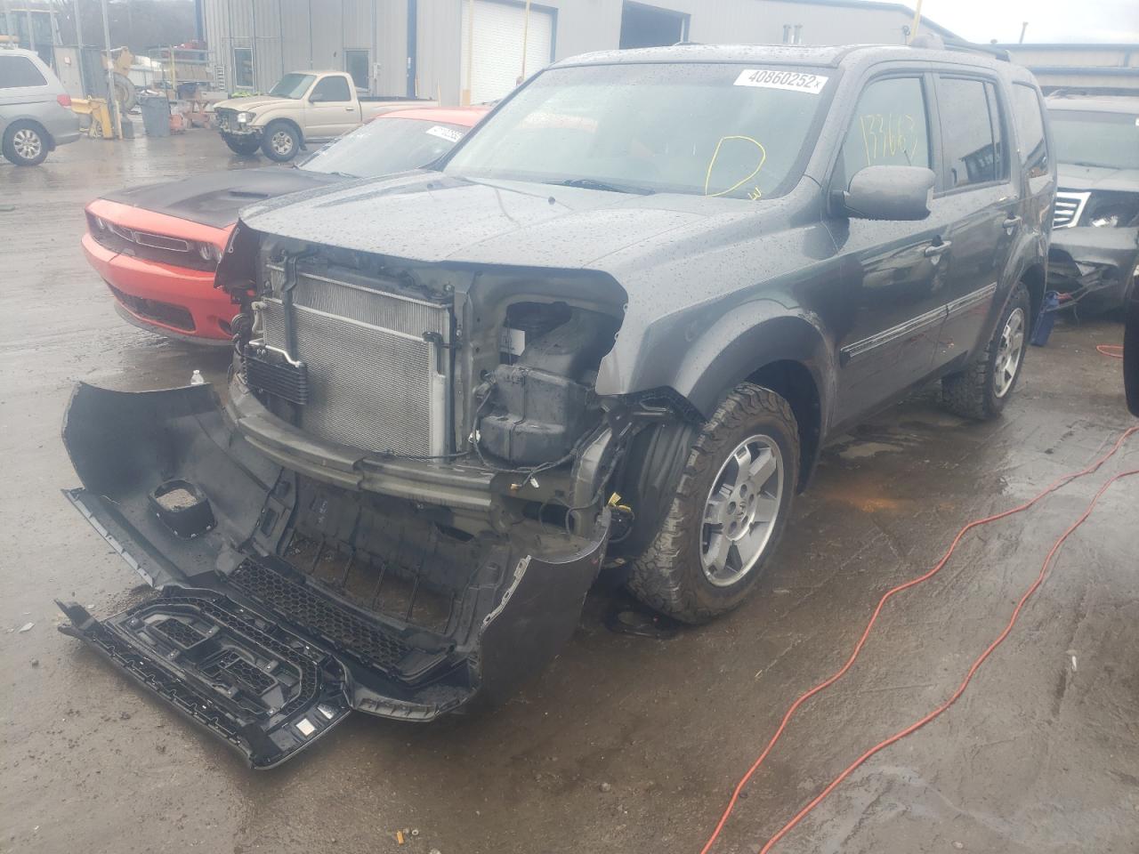 Photo 2 from auction – 2011 HONDA PILOT TOUR with VIN 5FNYF4H95BB059240