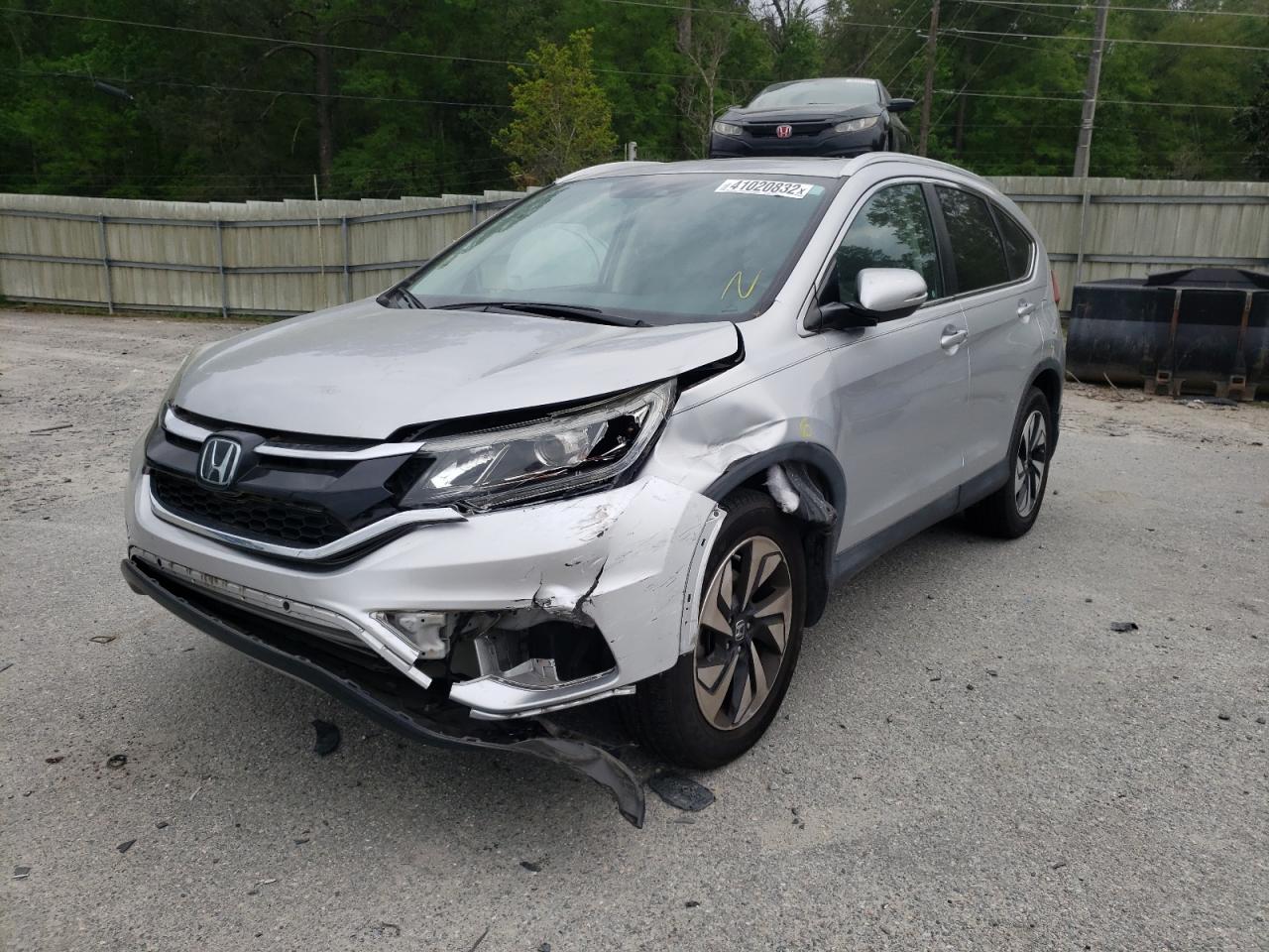 Photo 2 from auction – 2015 HONDA CR-V TOURI with VIN 5J6RM3H95FL020648