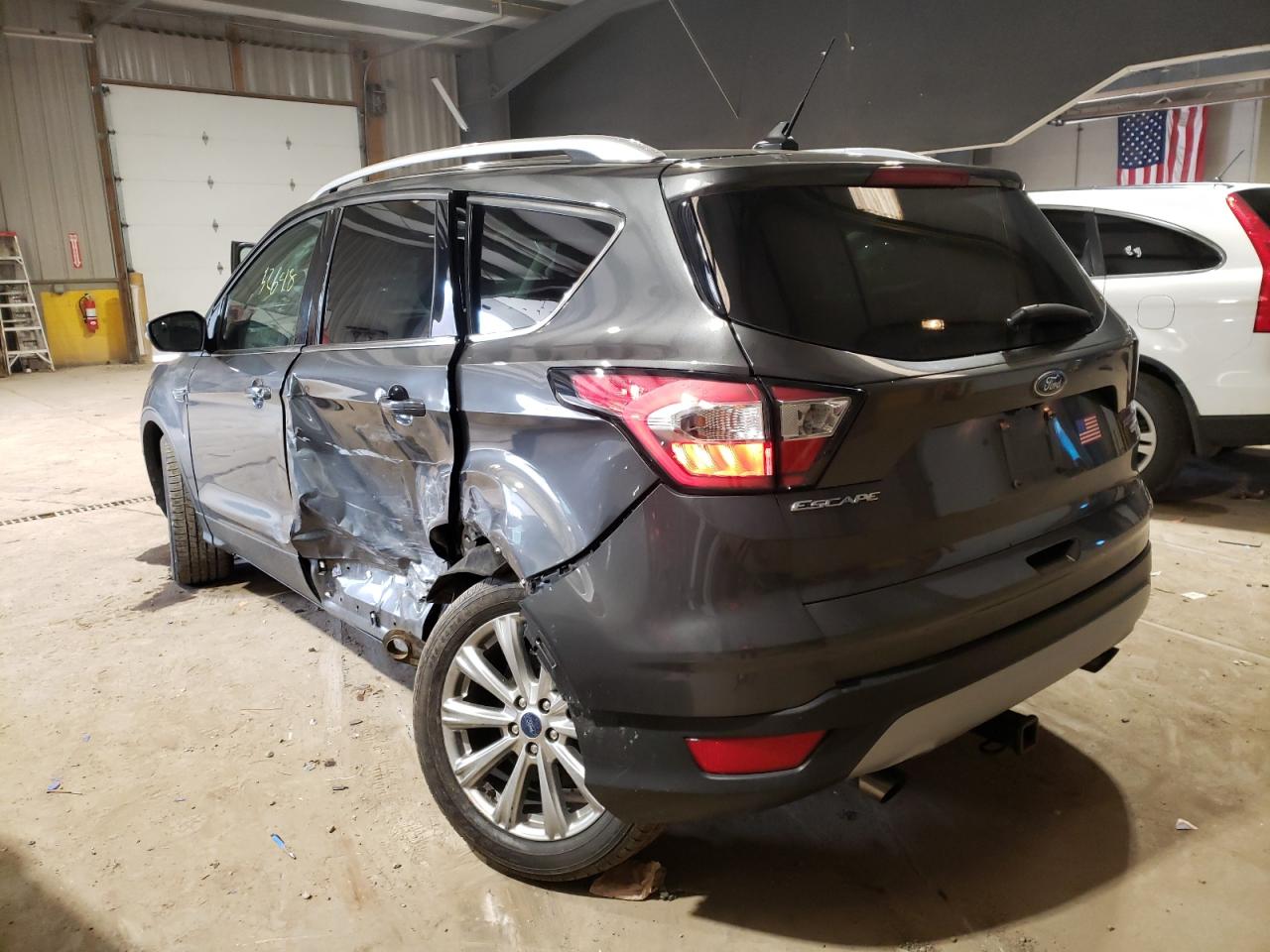 Photo 3 from auction – 2018 FORD ESCAPE TIT with VIN 1FMCU9J98JUB80689