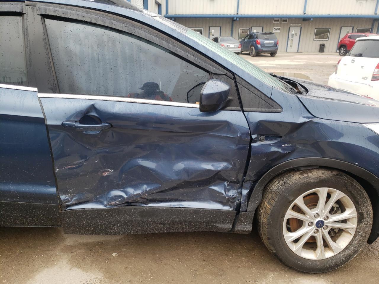 Photo 9 from auction – 2018 FORD ESCAPE SE with VIN 1FMCU9GD3JUB36403
