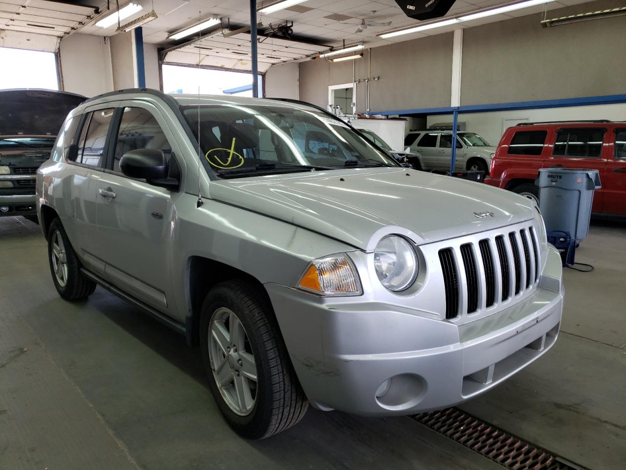 JEEP COMPASS SP 2010 with VIN 1J4NF4FB4AD564498 - Photo from auction