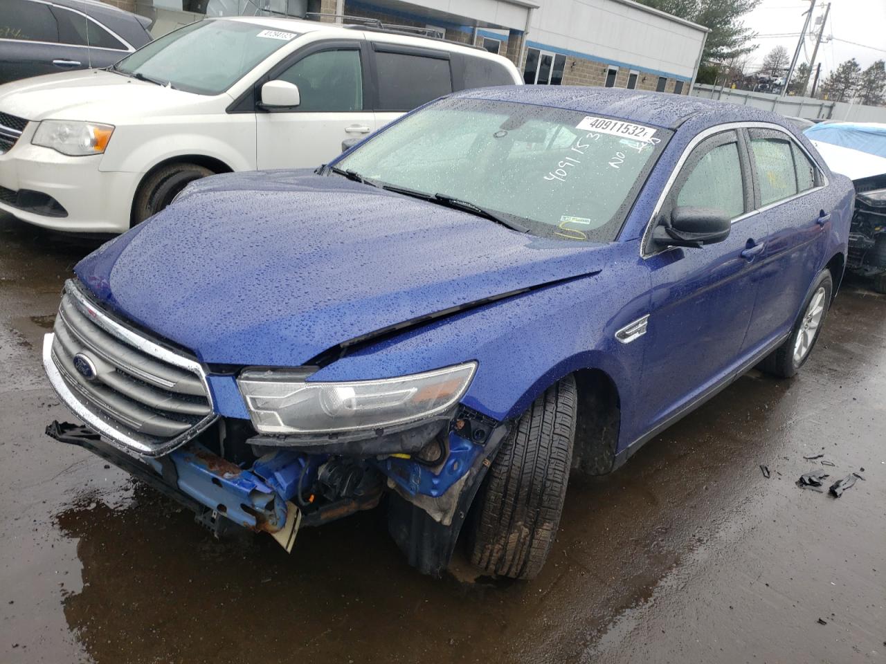 Photo 2 from auction – 2015 FORD TAURUS SE with VIN 1FAHP2D89FG112778