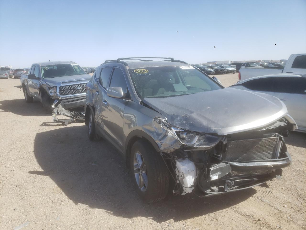 HYUNDAI SANTA FE S 2018 with VIN 5NMZU3LBXJH105575 - Photo from auction