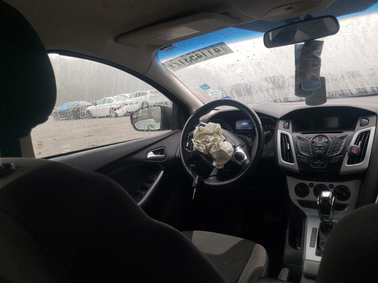 Foto 9 de la subasta – 2012 FORD FOCUS SE con VIN 1FAHP3F21CL420223