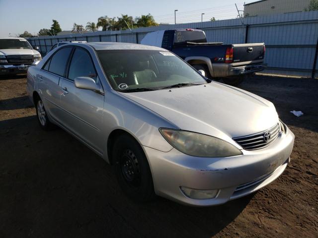TOYOTA CAMRY LE 2005 with VIN 4T1BF32K45U597821 - Photo from auction