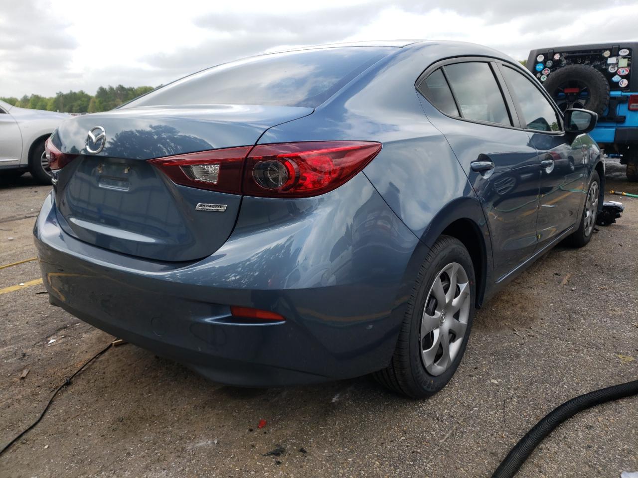 Photo 4 from auction – 2015 MAZDA 3 SPORT with VIN 3MZBM1U7XFM128209