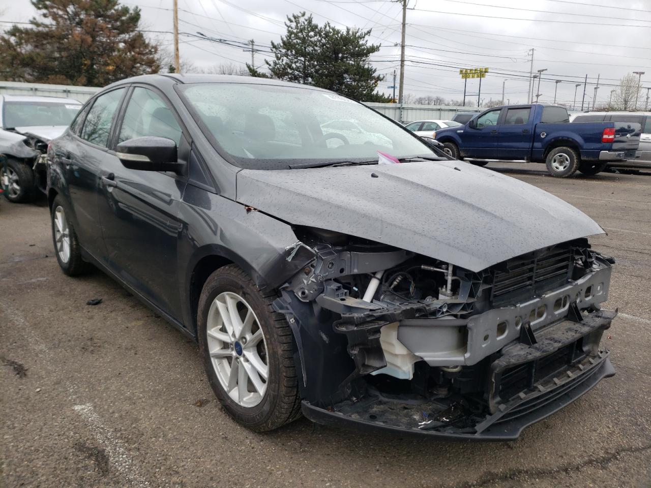 FORD FOCUS SE 2017 with VIN 1FADP3F23HL305810 - Photo from auction