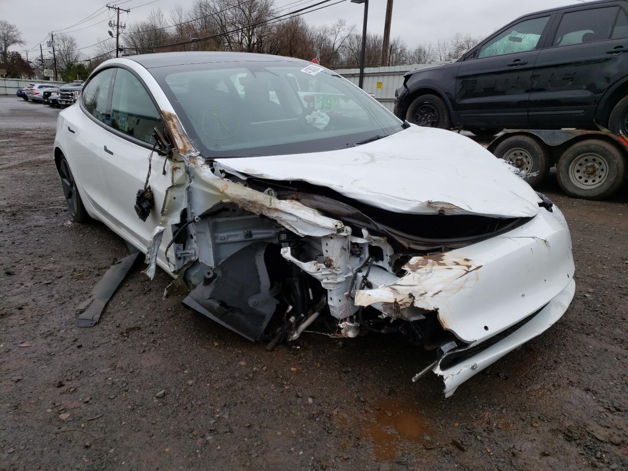 TESLA MODEL 3 2022 with VIN 5YJ3E1EB8NF106915 - Photo from auction