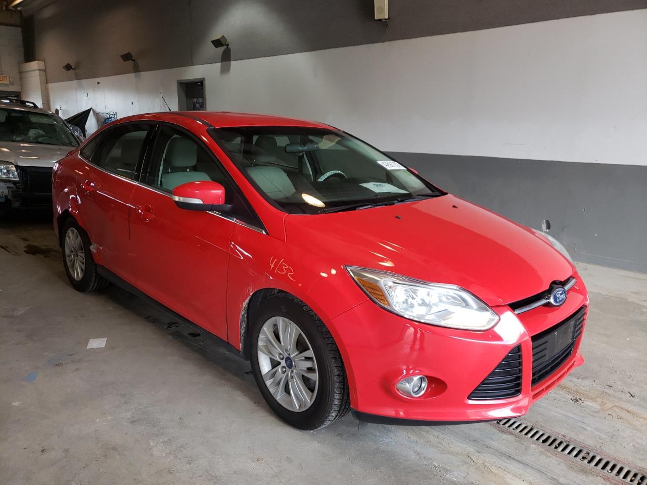 FORD FOCUS SEL 2012 with VIN 1FAHP3H2XCL275194 - Photo from auction