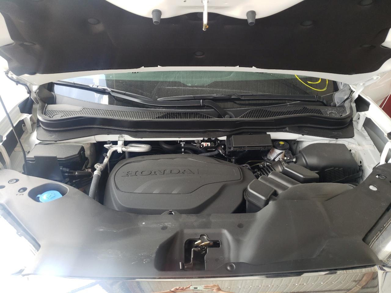 Photo 7 from auction – 2022 HONDA PASSPORT E with VIN 5FNYF7H59NB001134