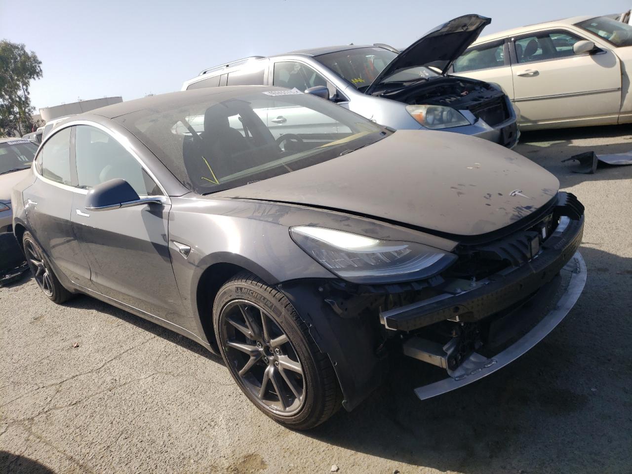 TESLA MODEL 3 2018 with VIN 5YJ3E1EB9JF077211 - Photo from auction