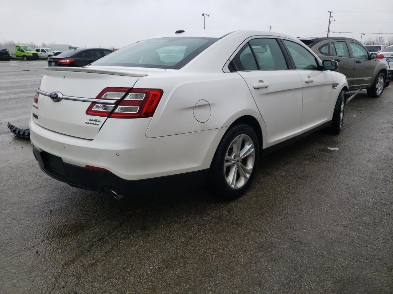 Photo 4 from auction – 2014 FORD TAURUS SEL with VIN 1FAHP2E85EG130952