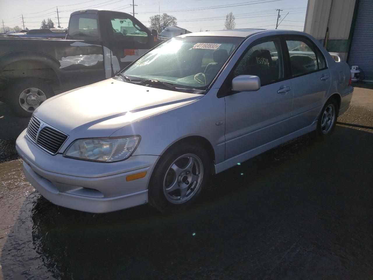 Photo 2 from auction – 2003 MITSUBISHI LANCER with VIN JA3AJ86E93U069414