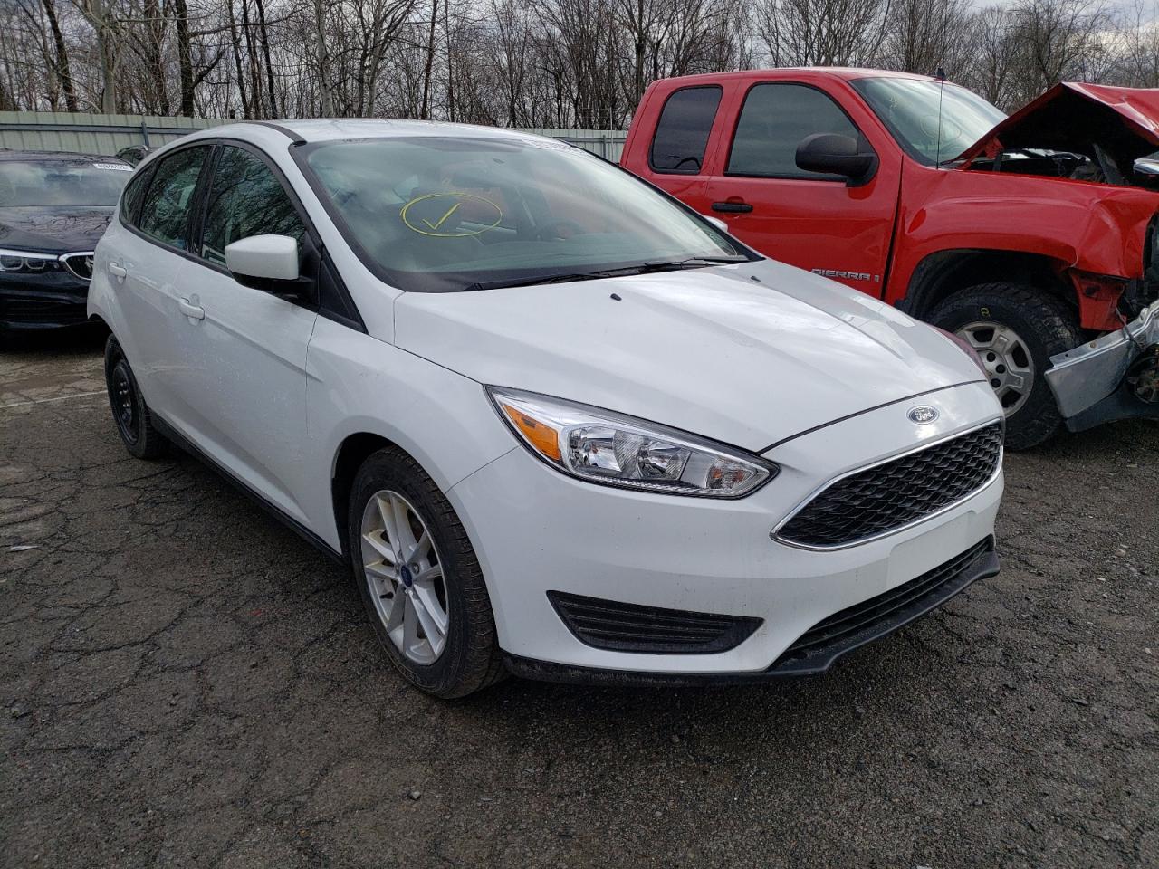 FORD FOCUS SE 2018 with VIN 1FADP3K26JL245047 - Photo from auction