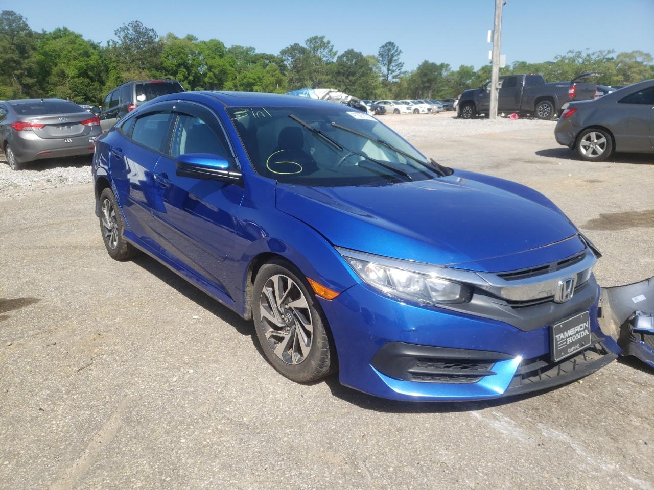 HONDA CIVIC EX 2018 with VIN 19XFC2F75JE013854 - Photo from auction
